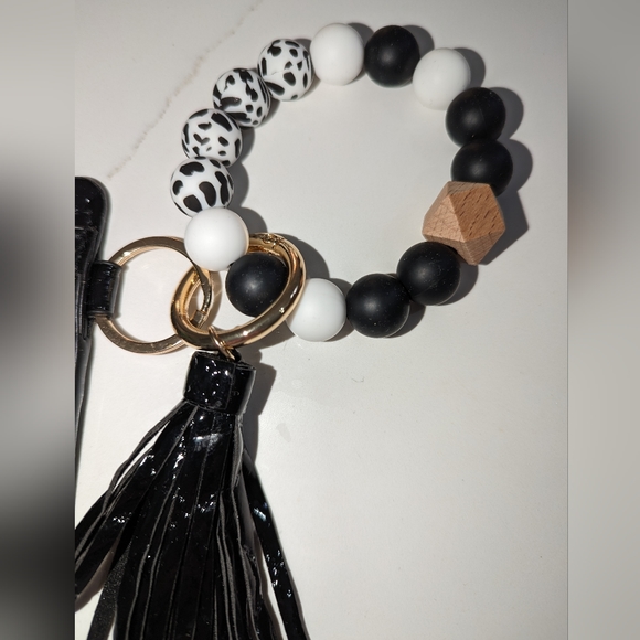 2/$35. Black card holder. Elastic wristlet. Jumbo beads. Brand new. - Picture 2 of 3